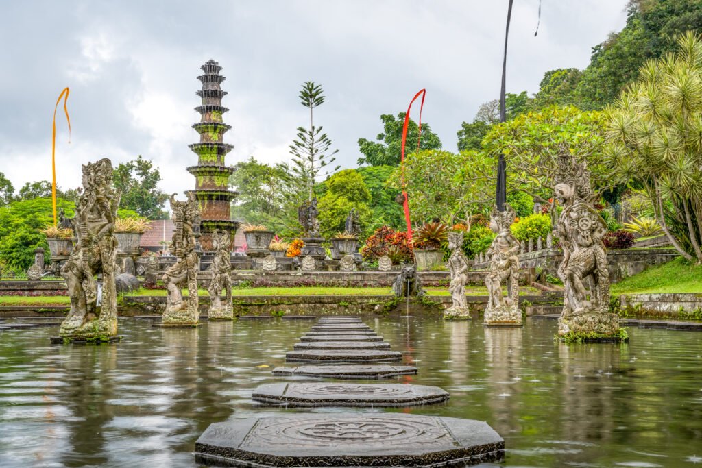 gorgeous shot of tirta gangga in indonesia, showing a beautiful lake, surreal garden and statues
