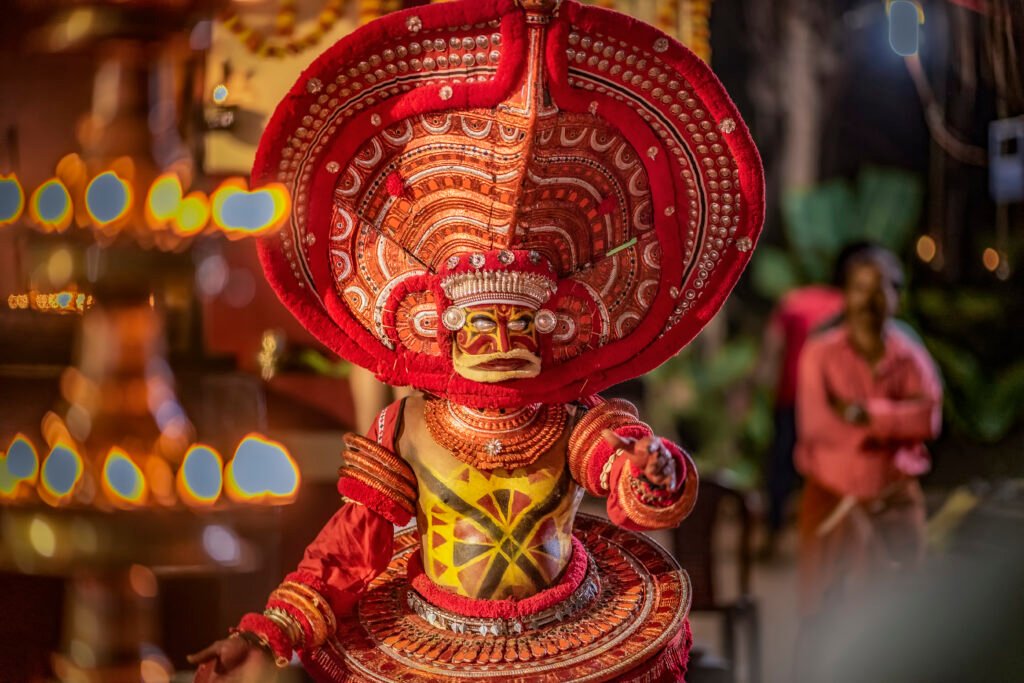 indian man performing theyyam ritual form of dance worship
