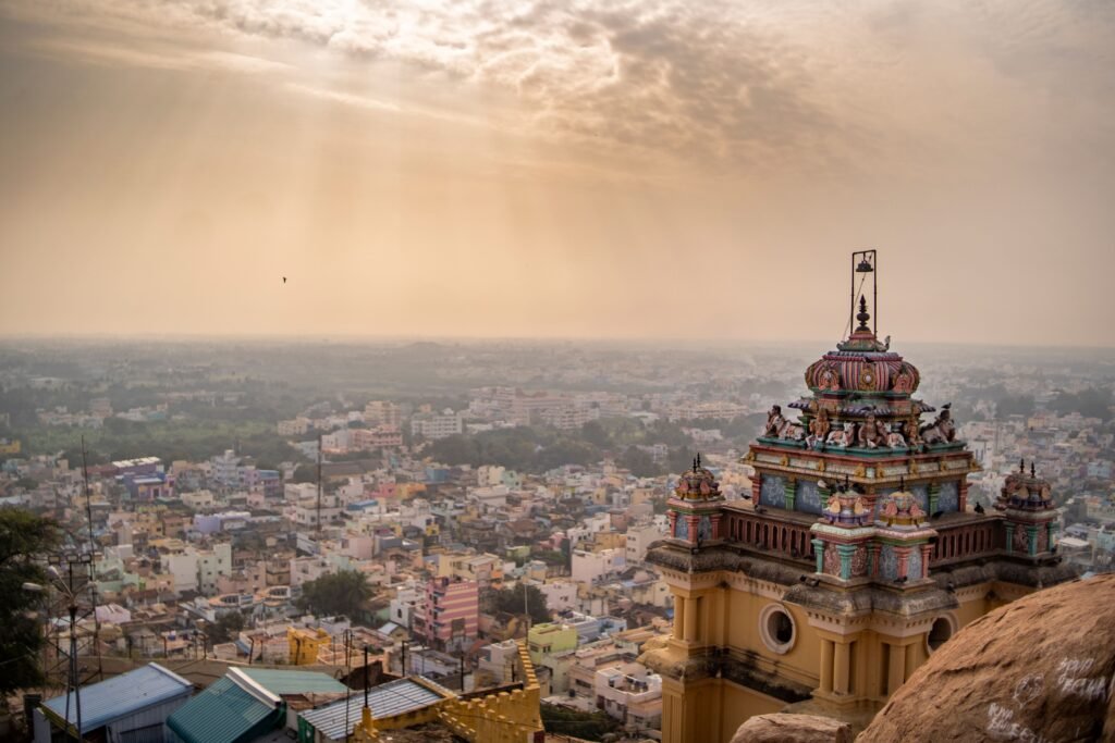 Jaipur & Udaipur – Two Cities, One Royal Soul roof of the ancient temple in trichy india with the cityscape in the sunny background