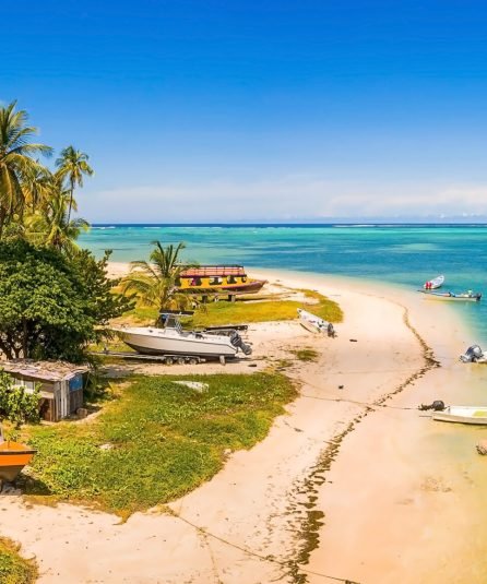fishing boats parked by the crystal clear turquoise caribbean